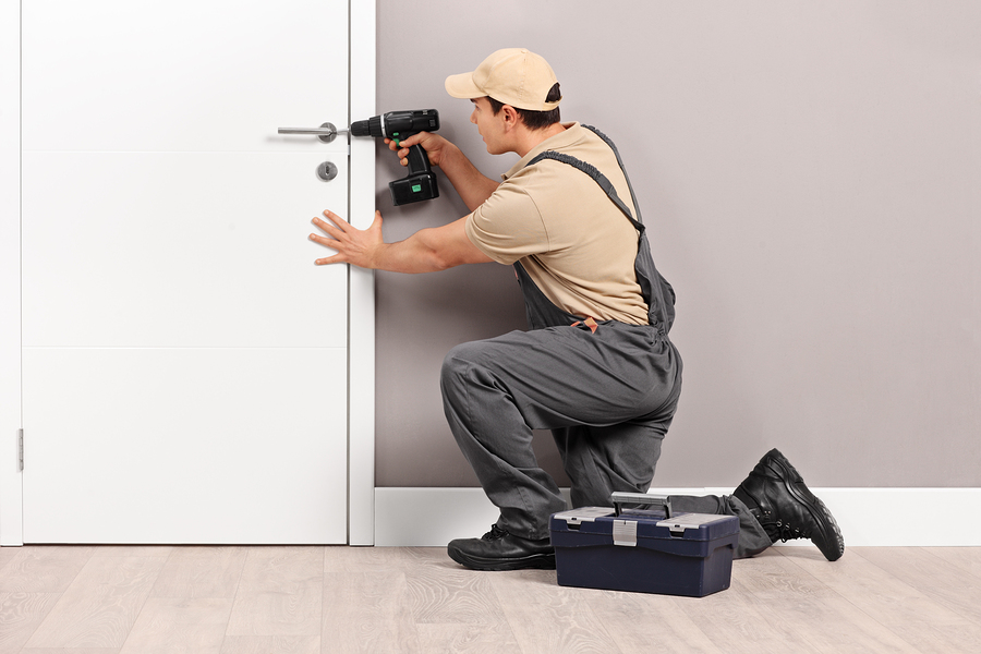 Automotive Locksmiths bigstock Young male locksmith installin 114413204 - Automotive Locksmiths