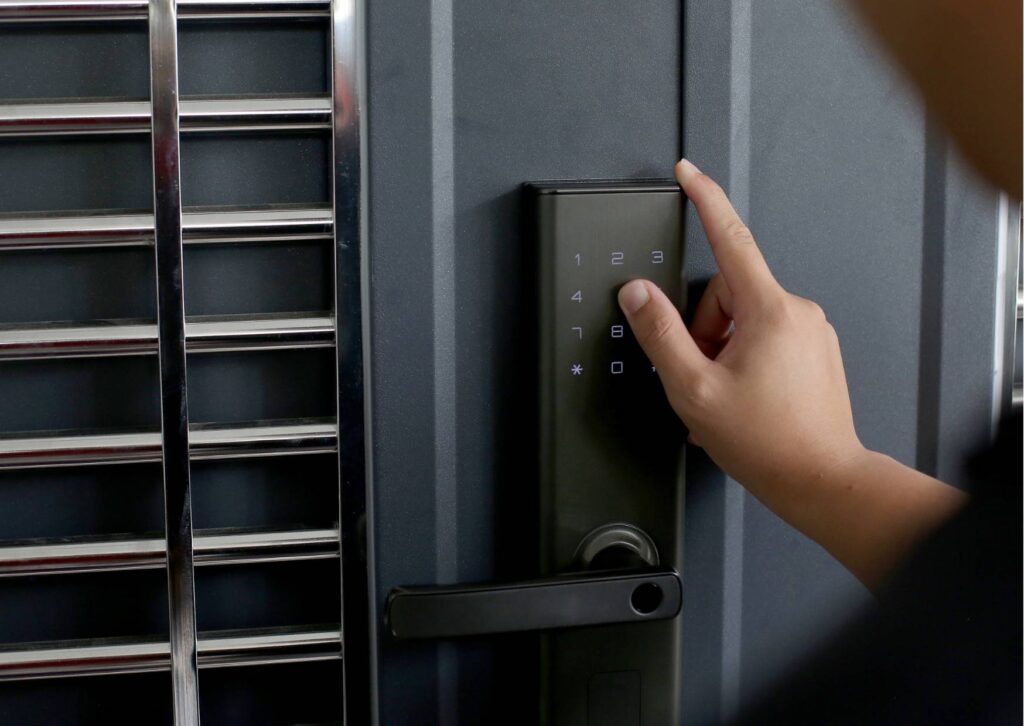 Person using a smartphone to unlock a smart lock on a front door during a cold Canberra morning, highlighting convenience and easy access in winter.